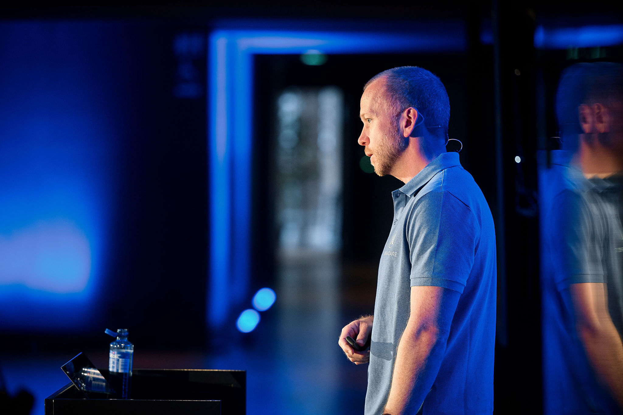 A man standing in front of a microphone